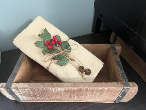 Flour Sack Towel tied with twine, holly and rusty bells