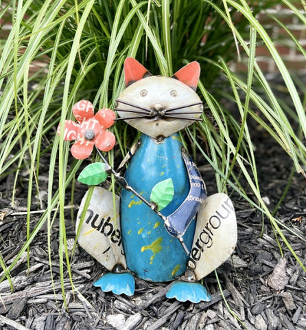 TIN CAT HOLDING A FLOWER