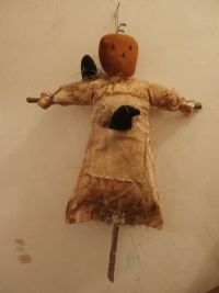 Pumpkin doll with crows